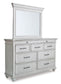 Kanwyn King Panel Bed with Storage with Mirrored Dresser and Chest