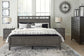 Montillan King Panel Bed with Mirrored Dresser, Chest and 2 Nightstands